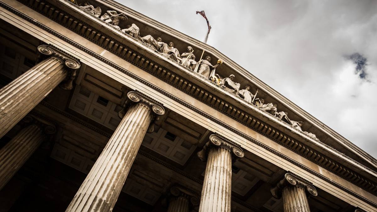 Neoclassical courthouse columns against the sky